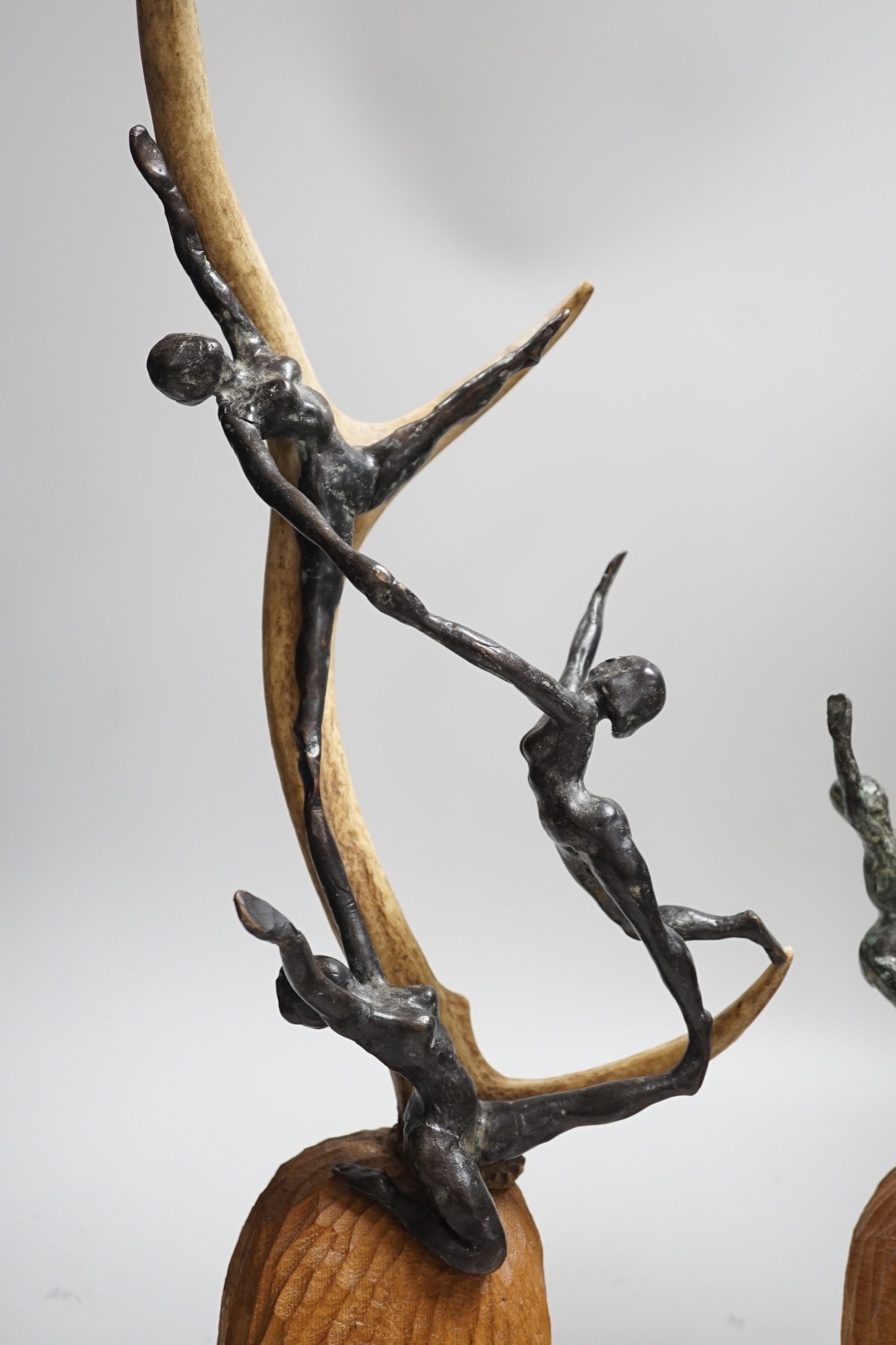 A pair of bronze and antler dancer groups in the style of Edgar Degas, 49cms high